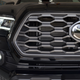 Those headlights and fogs are lovely LED units. The front camera can be seen below logo.